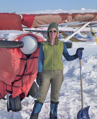 Jessica Cherry ’00, GSAS’07 takes a break after digging out her plane from a snowstorm in March 2012. PHOTO: BOB BUSEY